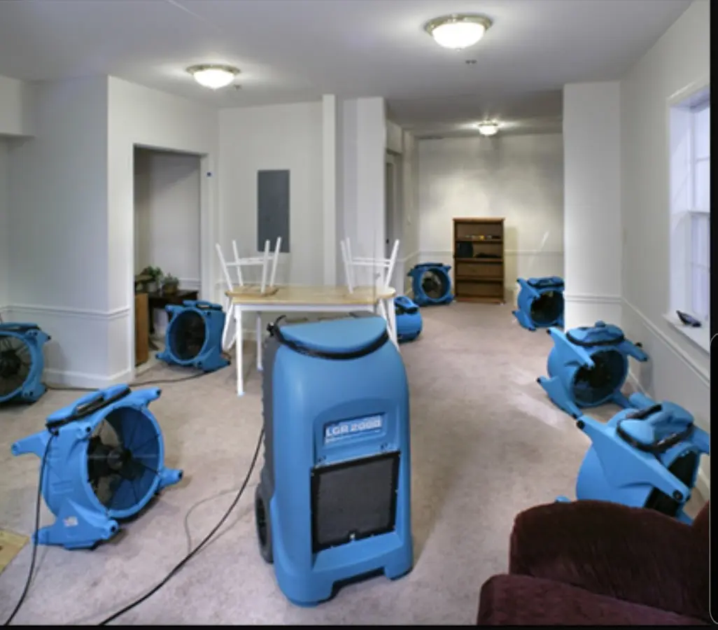 Air movers and dehumidifier setup for Water Damage Restoration in Edgewater